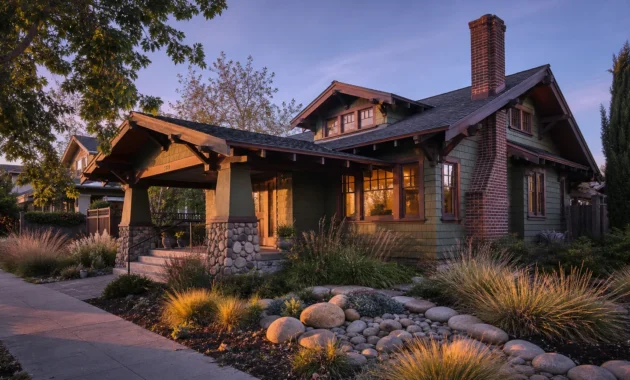 A classic Craftsman bungalow at sunset with a wide porch, tapered stone columns, and deep overhanging eaves.