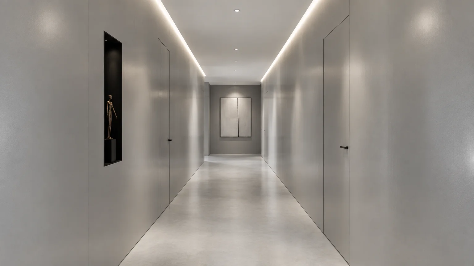 Minimalist gray hallway with recessed cove lighting, flush wall panels and doors, and artwork at the corridor's end.